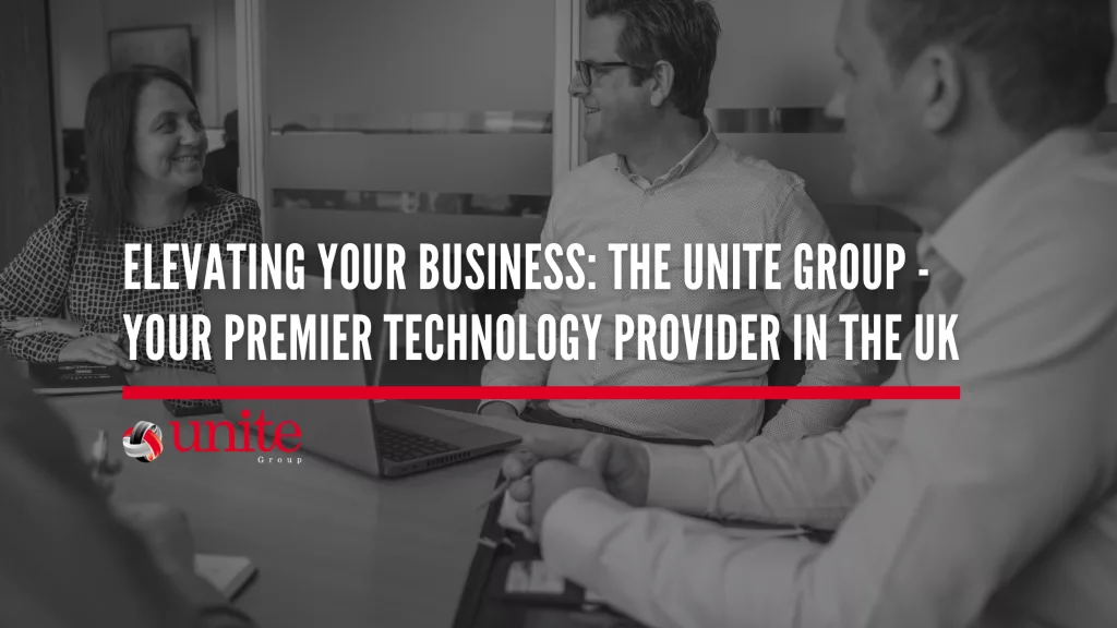 black and white image of 3 members of the unite group team sitting round a meeting table with a laptop. The text on top reads Elevating Your Business: The Unite Group - Your Premier Technology Provider in the UK